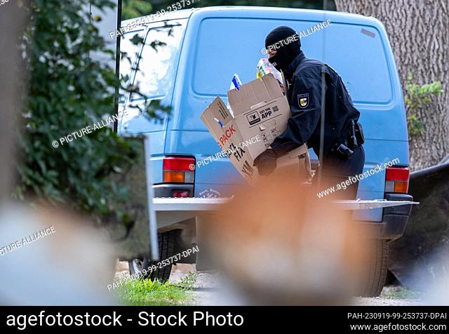 19 September 2023, Mecklenburg-Western Pomerania, Jamel: Police officers secure evidence at the home of Krüger, a right-wing extremist known throughout Germany