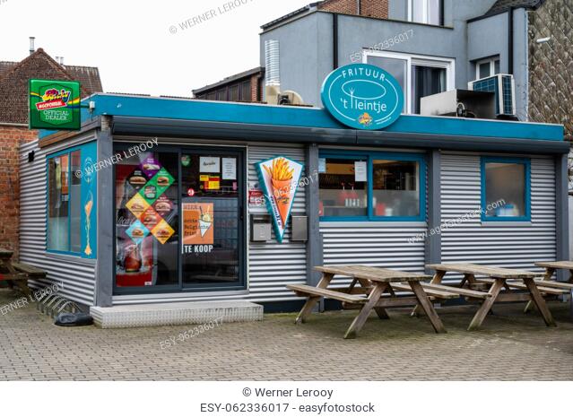 Borcht, Flemish Brabant Region - Belgium - Feb. 19 2023 - A traditional food stall selling French fries , burgers and other deep fried snacks