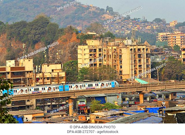 Metro train near Asalpha railway station, Mumbai, Maharashtra, India, Asia