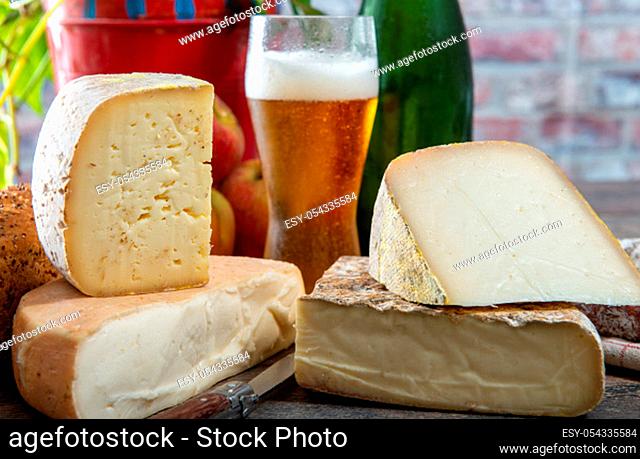 cheeses and Tomme de Savoie with a glass of beer, French cheese Savoy, french Alps France