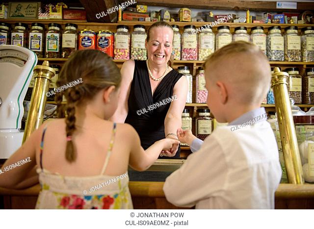 Children buying sweets from traditional sweet shop