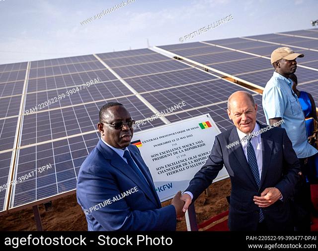 22 May 2022, Senegal, Dakar: German Chancellor Olaf Scholz (SPD), attends the opening of a photovoltaic plant in Diass alongside Macky Sall
