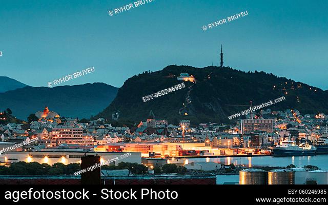 Alesund, Norway. Alesund Skyline Cityscape And Port Terminal In Evening Night Lighting. Historical Center In Summer. Famous Norwegian Landmark And Popular...