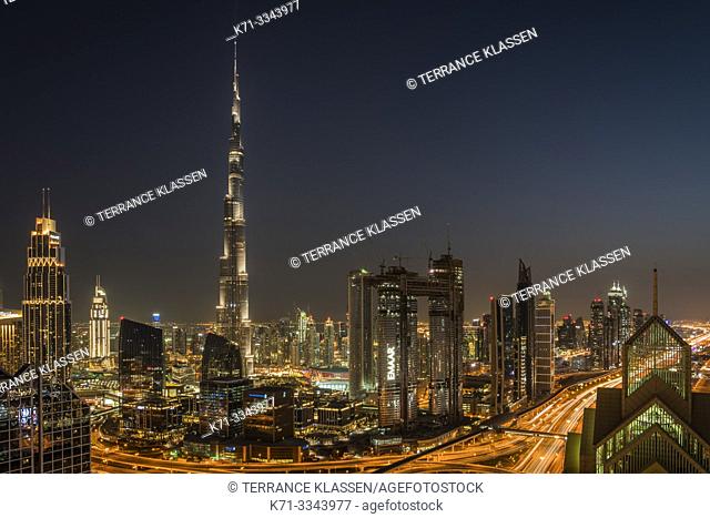 The Burj Khalifa and city skyline at night in downtown Dubai, UAE, Middle East