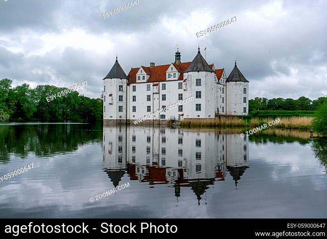 Gluecksburg, Germany - 27 May, 2021: view of the Gluecksburg castle in northern Germany with beautiful reflections in the lake