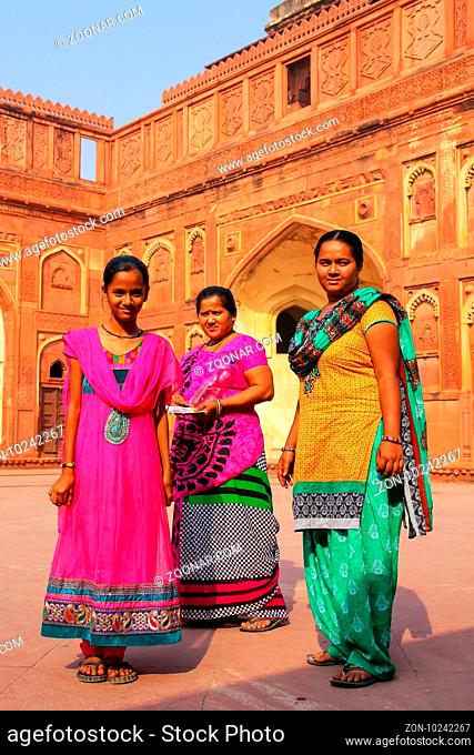 Women standing in the courtyard of Jahangiri Mahal in Agra Fort, Uttar Pradesh, India. The fort was built primarily as a military structure