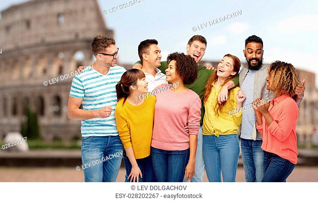 diversity, travel, tourism and people concept - international group of happy men and women laughing over coliseum background