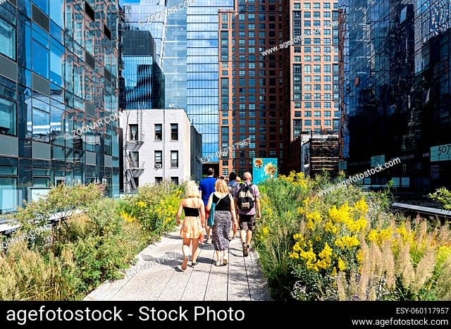 New York, United States of America - September 21, 2019: People stroll along the High Line Park in Manhattan. The urban park is popular by locals and tourists...