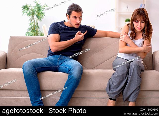 Young couple in the domestic violence concept