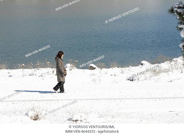 Woman walking by Doxa Lake. Doxa Laka, Feneo, Corinthia, Peloponnese, Greece