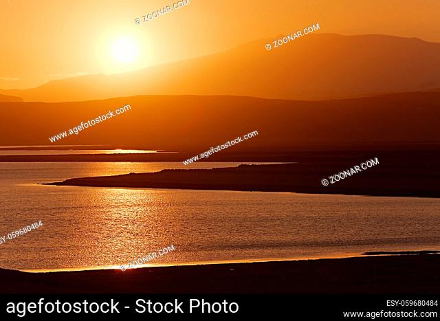 Sunset landscape with hills and lakes