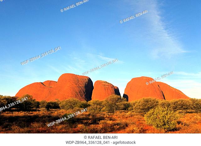 YULARA, NT - MAY 16 2019:Kata Tjuta Olgas at sunset.The Anangu people believe the great rocks are homes to spirit from the 'Dreaming'