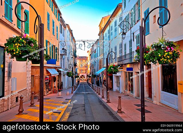 Colorful street in Antibes walkway and shops view, Southern France