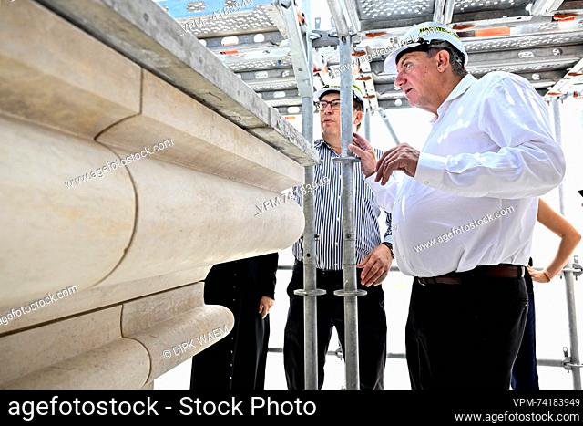 Flemish Minister President Jan Jambon speaks to a site manager of Group Monument during a visit of the Notre-Dame Cathedral of Saigon in the marge of a trade...