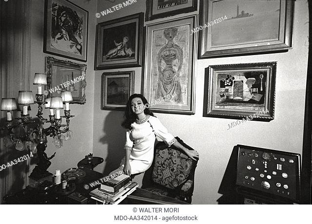 Portrait of Bedy Moratti in her house. The Italian actress Bedy Moratti posing for a portrait at her home. Milan, May 1968