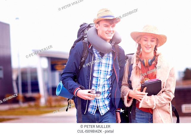 Backpacker couple at airport
