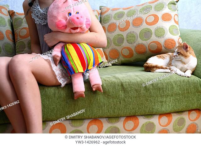 Beautiful Blond girl with her Plush Pig