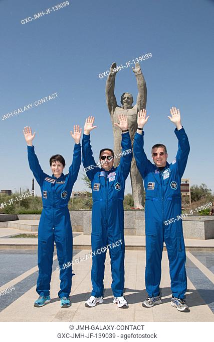 In front of the statue of Yuri Gagarin, the first human in space, in the town of Baikonur, Kazakhstan, Expedition 4041 backup crew members Samantha...