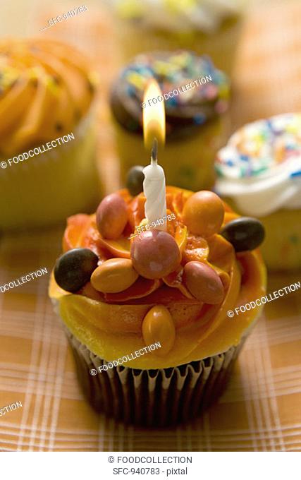 Small cake with a birthday candle