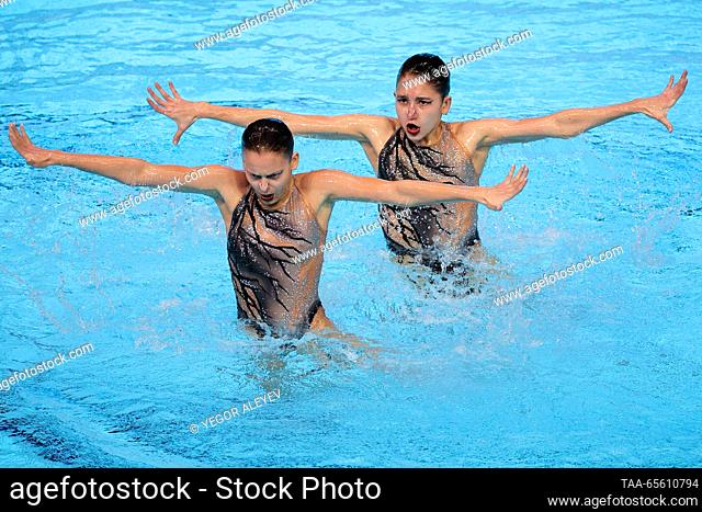 RUSSIA, KAZAN - DECEMBER 10, 2023: Swimmers Aleksandra Klenina and Ramilya Vanipatova of Russia perform their duet free routine of the junior event during the...