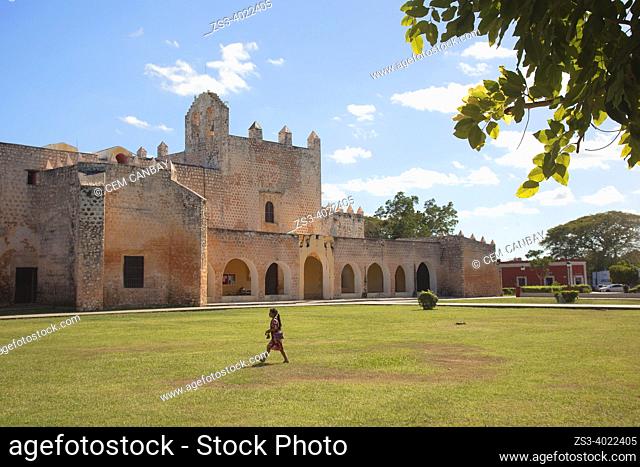 Indigenous girl in front of the Convent Of San Bernardino De Siena at the historic center, Valladolid, Yucatan Province, Mexico, Central America