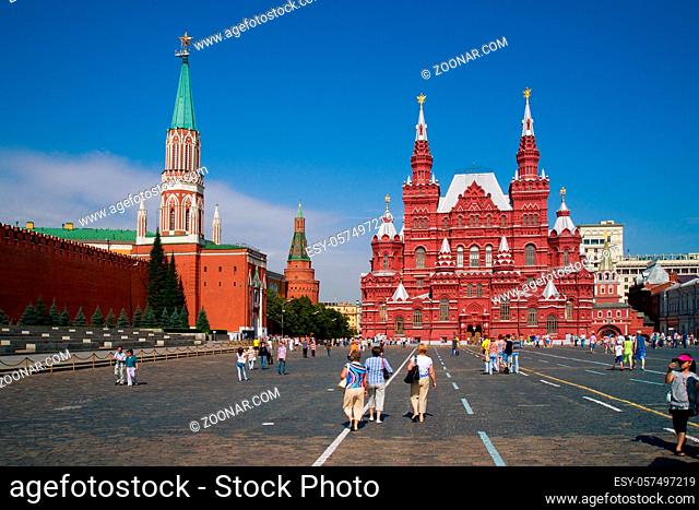 MOSCOW, RUSSIA - JULY, 24: Tourists walking on Red square near Kremlin wall and Historical Museum on July 24, 2011 in Moscow, Russia