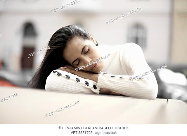 woman sleeping at table