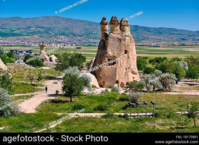 Picturesque landscape of shaped sandstone rocks. Famous Fairy Chimneys or Multihead stone mushrooms in Pasabagi Valley, Goreme, Cappadocia, Anatolia