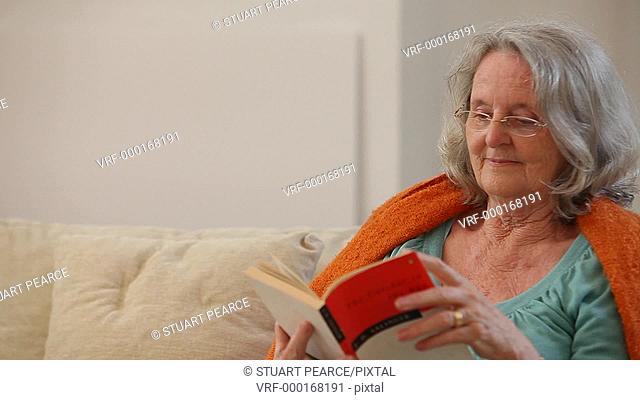 Senior woman reading a book