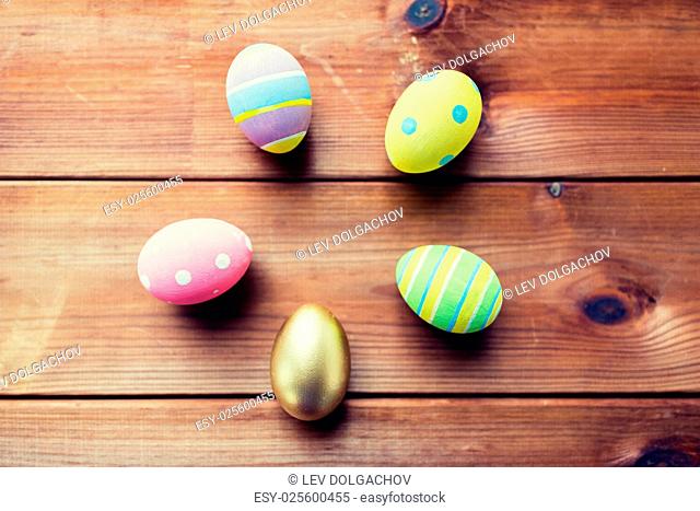 easter, holidays, tradition and object concept - close up of colored easter eggs