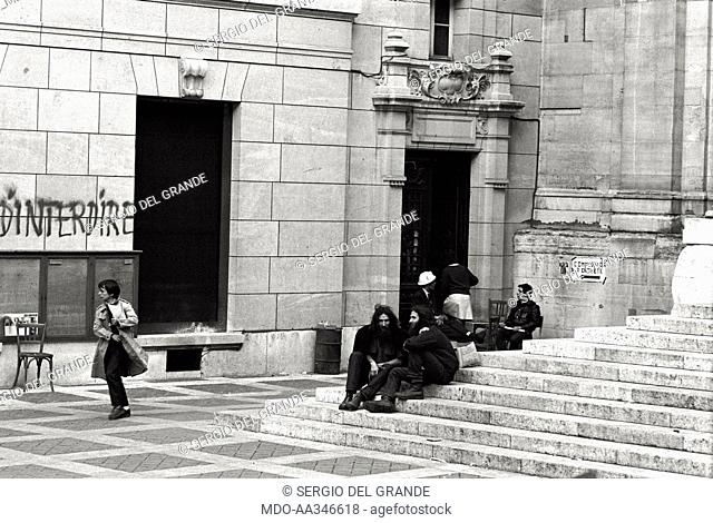 Occupation of the Sorbonne in Paris. Two young men with long beard and hair are sat on the stairs at the entrance of the Sorbonne headquarter