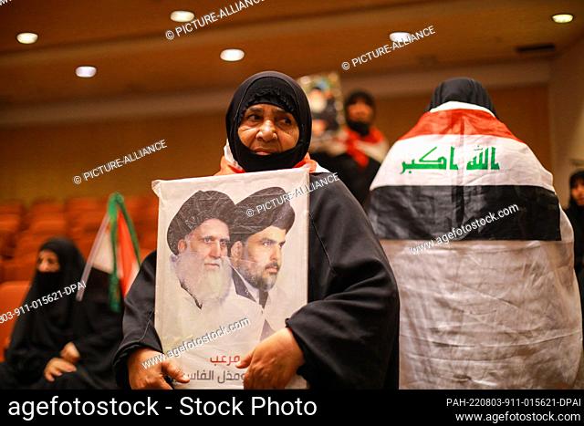 03 August 2022, Iraq, Baghdad: A supporter of Iraq's influential Shiite cleric Muqtada al-Sadr takes part in a sit-in at the parliament building amid political...