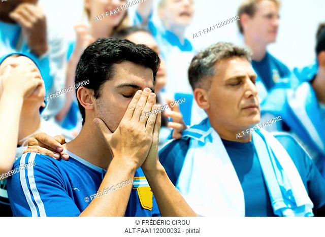 Argentinian football fans watching football match