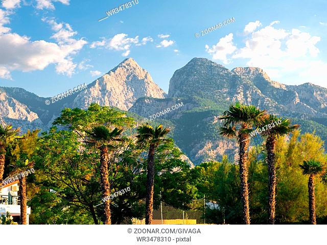 Park and mountains in Kemer at summer day, Turkey