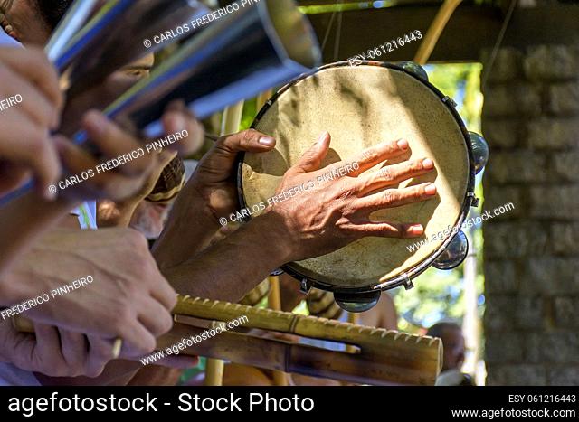 Tambourine and others usually rustics percursion instruments used during capoeira brought from africa and modified by the slaves