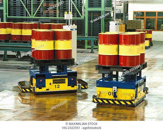 Robots transporting oil drums in production hall - 01/01/2010