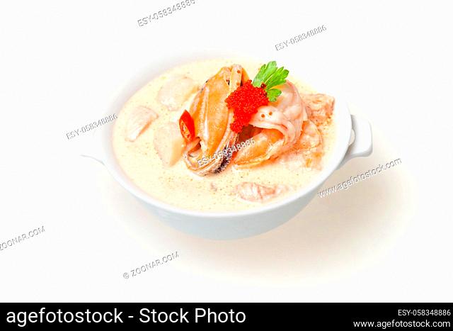 Traditional Japanese miso soup with seaweed and fish. Close-up, top view. Concept - food delivery