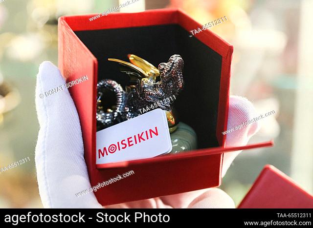 RUSSIA, YEKATERINBURG - DECEMBER 6, 2023: The Moiseikin jewellery house packages a silver dragon resting on a jasper stone; the Chinese calendar names 2024 the...
