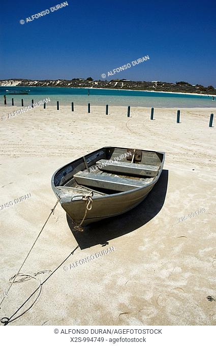 Boat moored in the sand