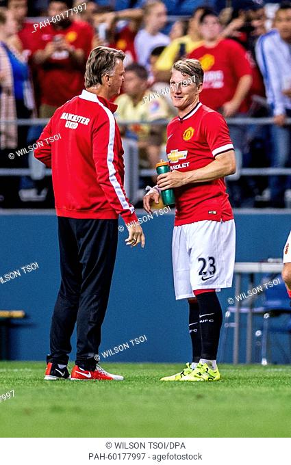 Manchester United's Bastian Schweinsteiger speaks to his coach Louis van Gaal during the soccer friendly match between Manchester United and Club America at the...