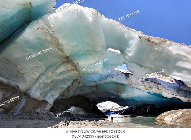 Ice cave and glacier snout of Schlatenkees, source of the creek Schlatenbach  parts of the have collapsed and melted away  Therefore an ice cave with two...