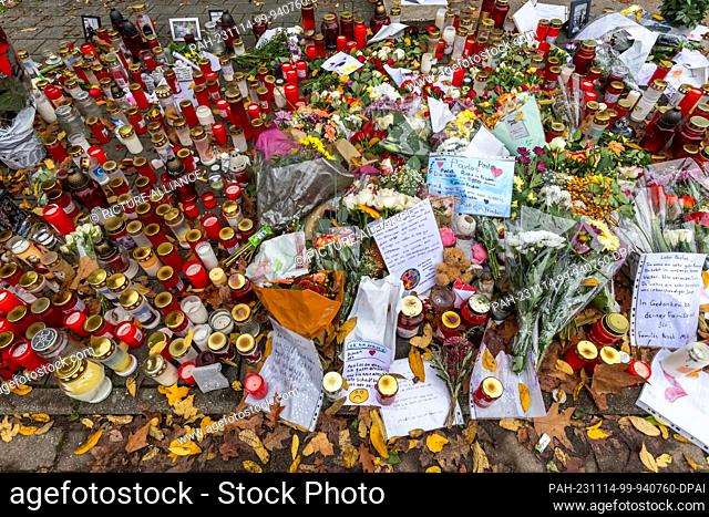 14 November 2023, Baden-Württemberg, Offenburg: Candles and flowers lie in front of the entrance to Waldbach School. The public prosecutor's office in Offenburg...