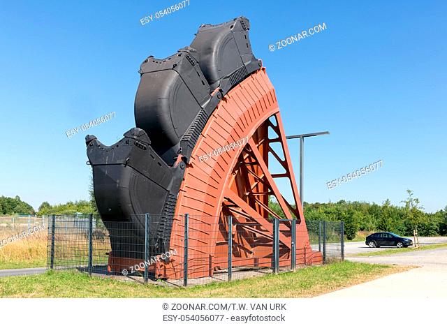Exposition of bucket wheel at original size from digging excavator in open pit coal mines in Germany