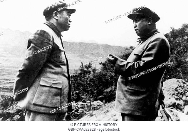 Korea / China: Peng Dehuai (left), Commander in Chief Chinese People's Volunteer Army in Korea, discusses strategy with North Korean leader Kim Il-sung...