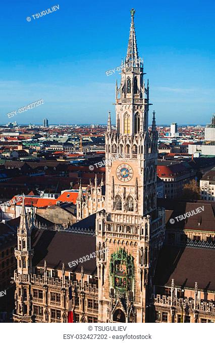 Beautiful super wide-angle sunny aerial view of Munich, Bayern, Germany with skyline and scenery beyond the city, seen from the observation deck of St