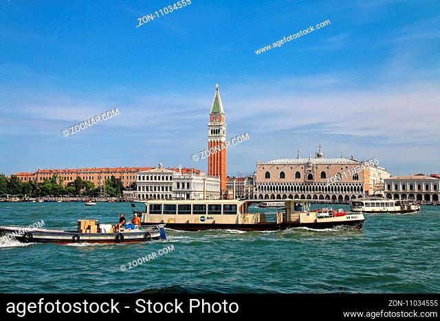 Vaporetto (water bus) going in front of Piazza San Marco in Venice, Italy. Venice is situated across a group of 117 small islands that are separated by canals...