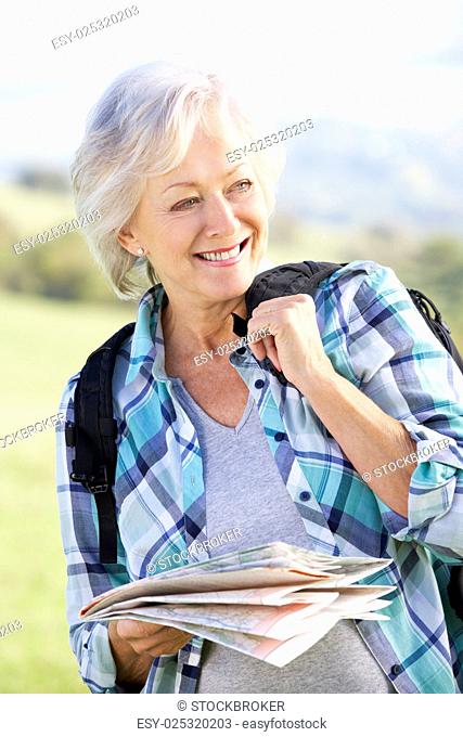 Senior woman on country walk