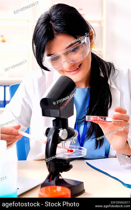 Female chemist working at the lab
