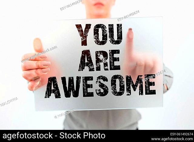 Text sign showing You Are Awesome, Business concept To have a great opinion about someone Admiration Wonder Businessman In Suit Displaying With One Hand Pattern...