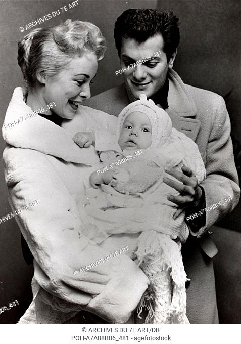Janet Leigh and Tony Curtis with their daughter Jamie Lee. November 1958. WARNING: It is forbidden to reproduce the photograph out of context of the promotion...